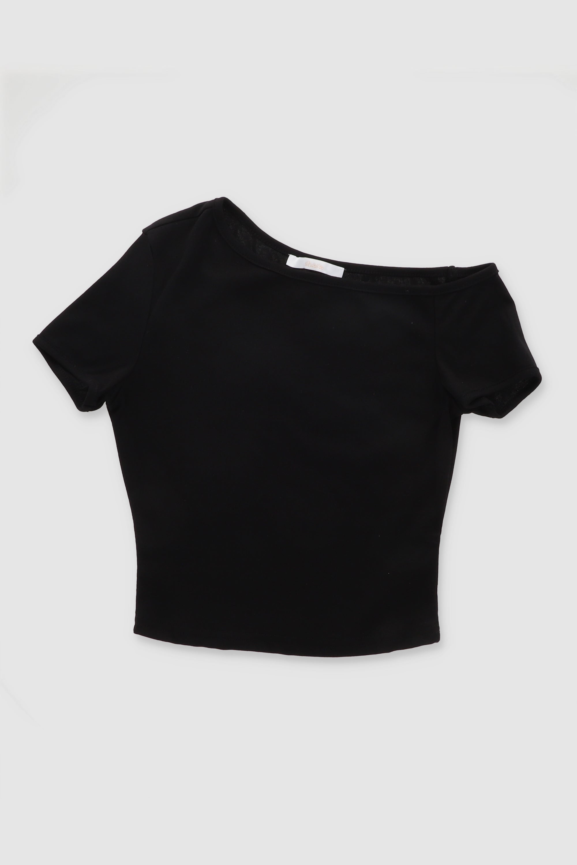 Top asimetrico liso NEGRO