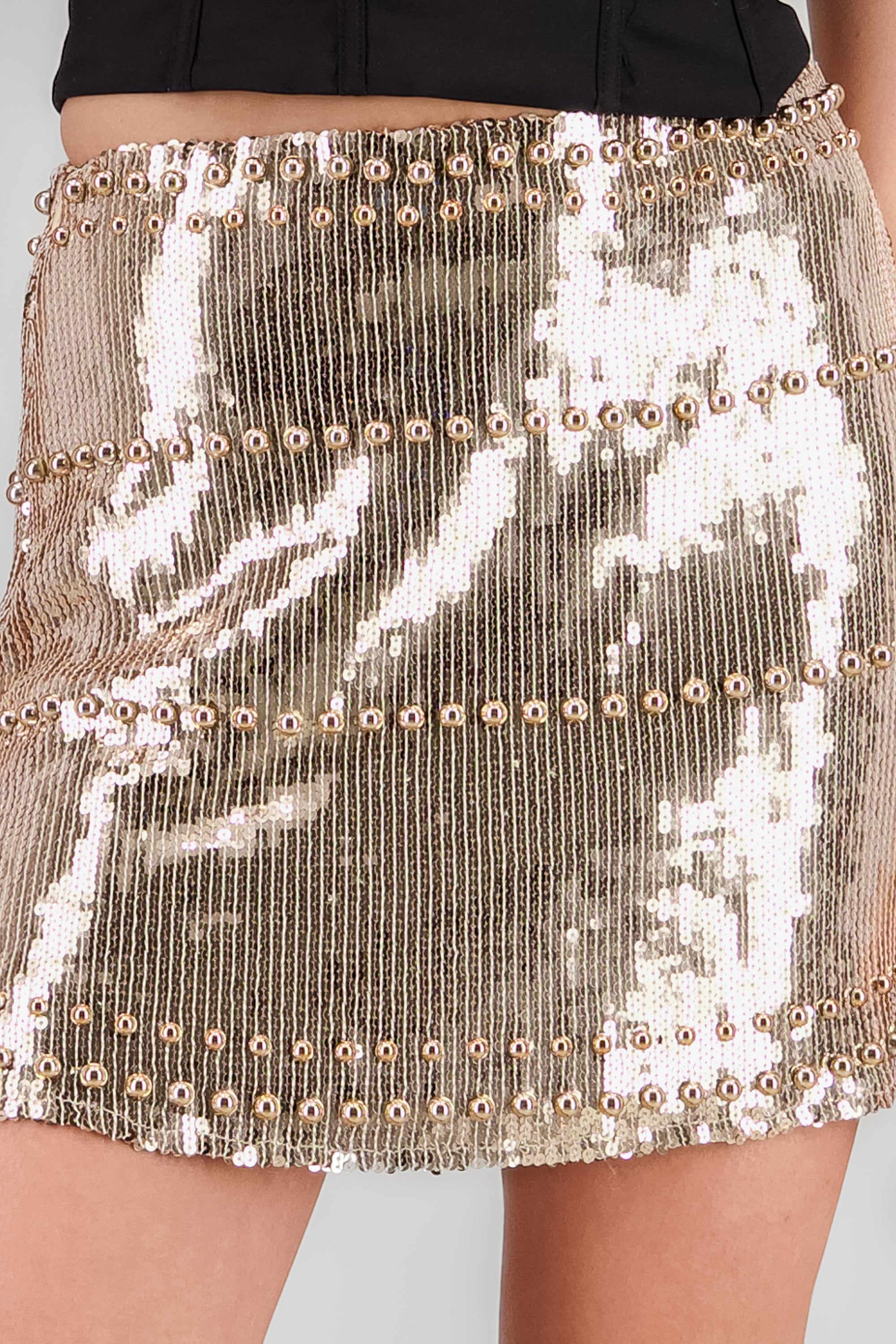 Falda mini lentejuela detalle aplicacion ORO