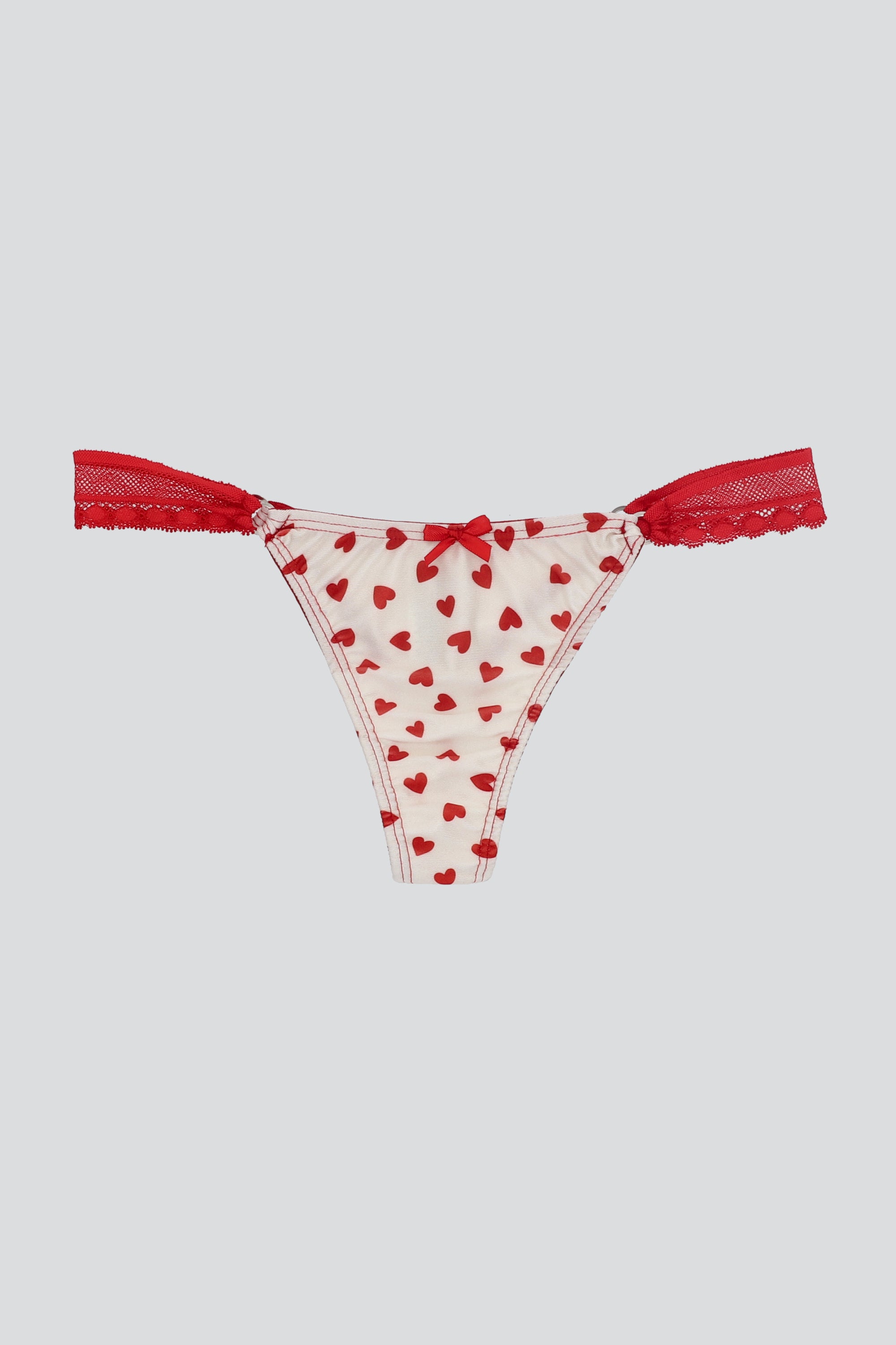 Tanga detalle lateral estampado formas HUESO